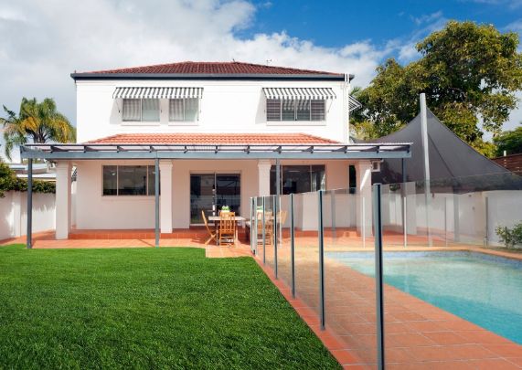 gorgeous pool view with a frameless glass pool fencing by Rockhampton Fencing Pros